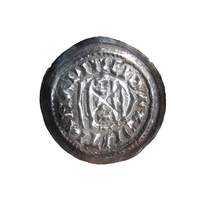 A Frankish denier coin dating from the first half of the 9th century. In the name of the Frankish emperor Louis the Pious (814-40). It shows a design copied from a Roman temple, and carries the inscription CHRISTIANA RELIGIO as well the emperor’s name and title. The wide flan on which this particular coin was struck is typical of Frankish coins from northern Italy