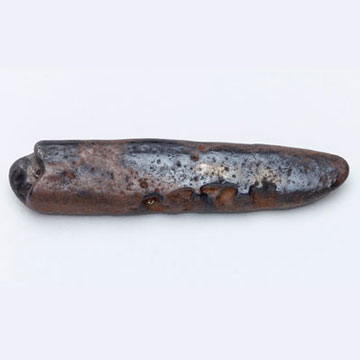 A silver ingot, used as bullion. The economy of Viking / Anglo-Scandinavian Britain was based on the weight of precious metal, as such this ingot was used as money and may have been broken (or hacked) into smaller piece. This one weighs 59.65g which is equivalent to a little over two Viking ounces, or around 45 of the Anglo-Saxon silver pennies. Ingots are common finds in Viking hoards of 9th-10th century date.